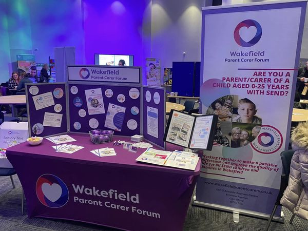 Photo of stall branded with Wakefield Parent Carer Forum posters